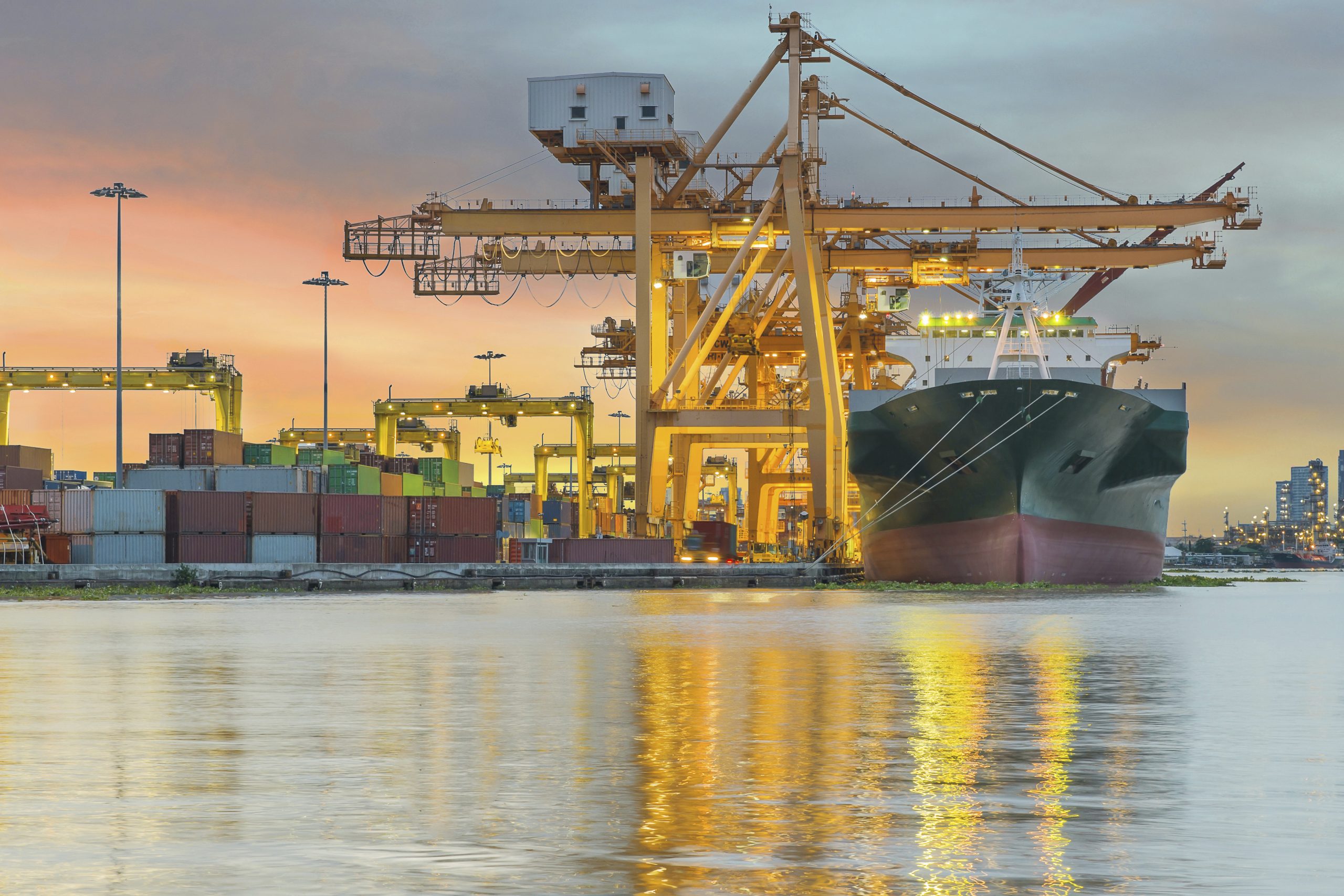 Industrial Container Cargo freight ship with working crane bridg